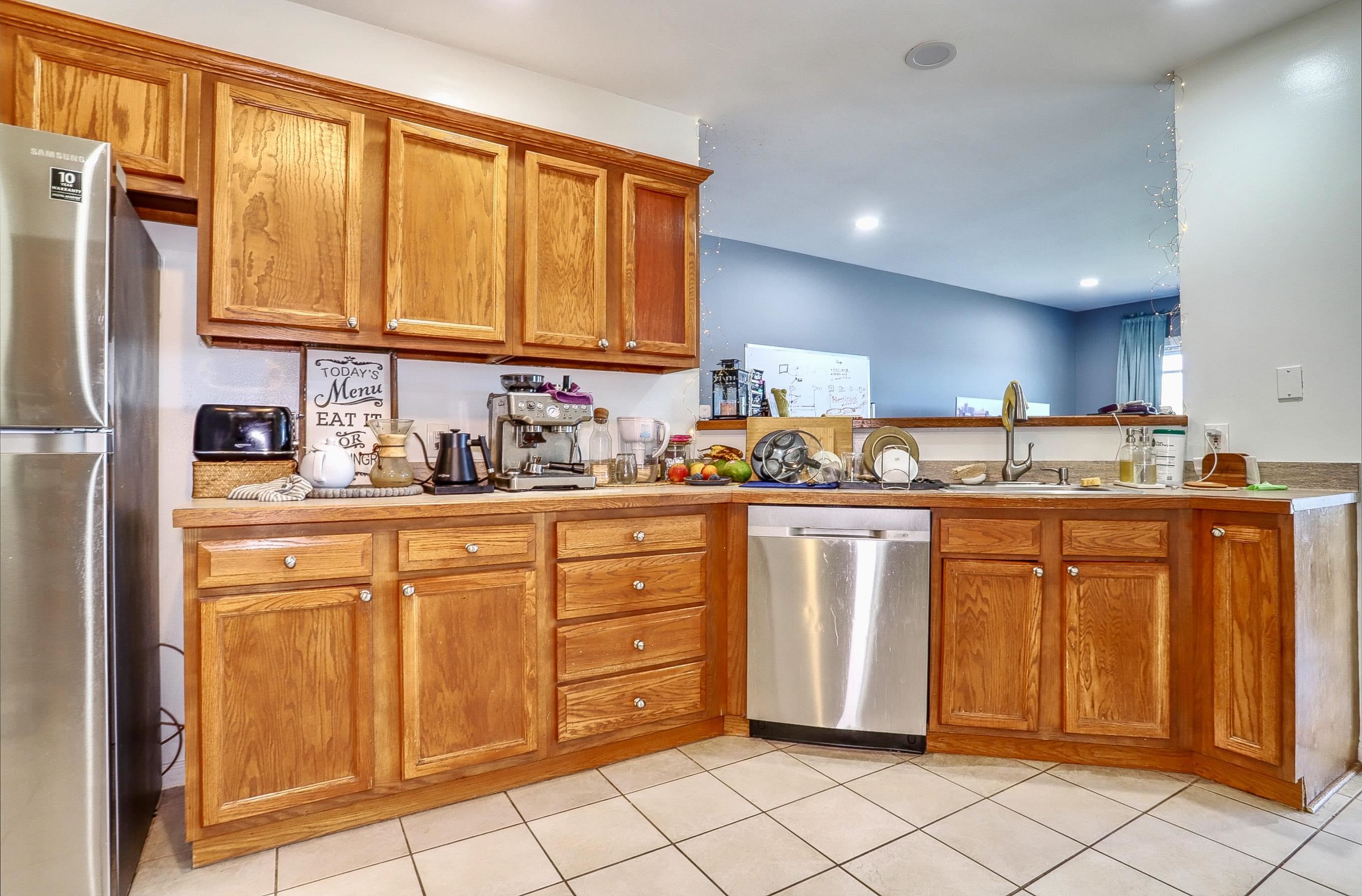 340 The Promenade, Unit 340 Edgewater, NJ 07020 - Photo 11 of 20 a kitchen with stainless steel appliances granite countertop a refrigerator and cabinets