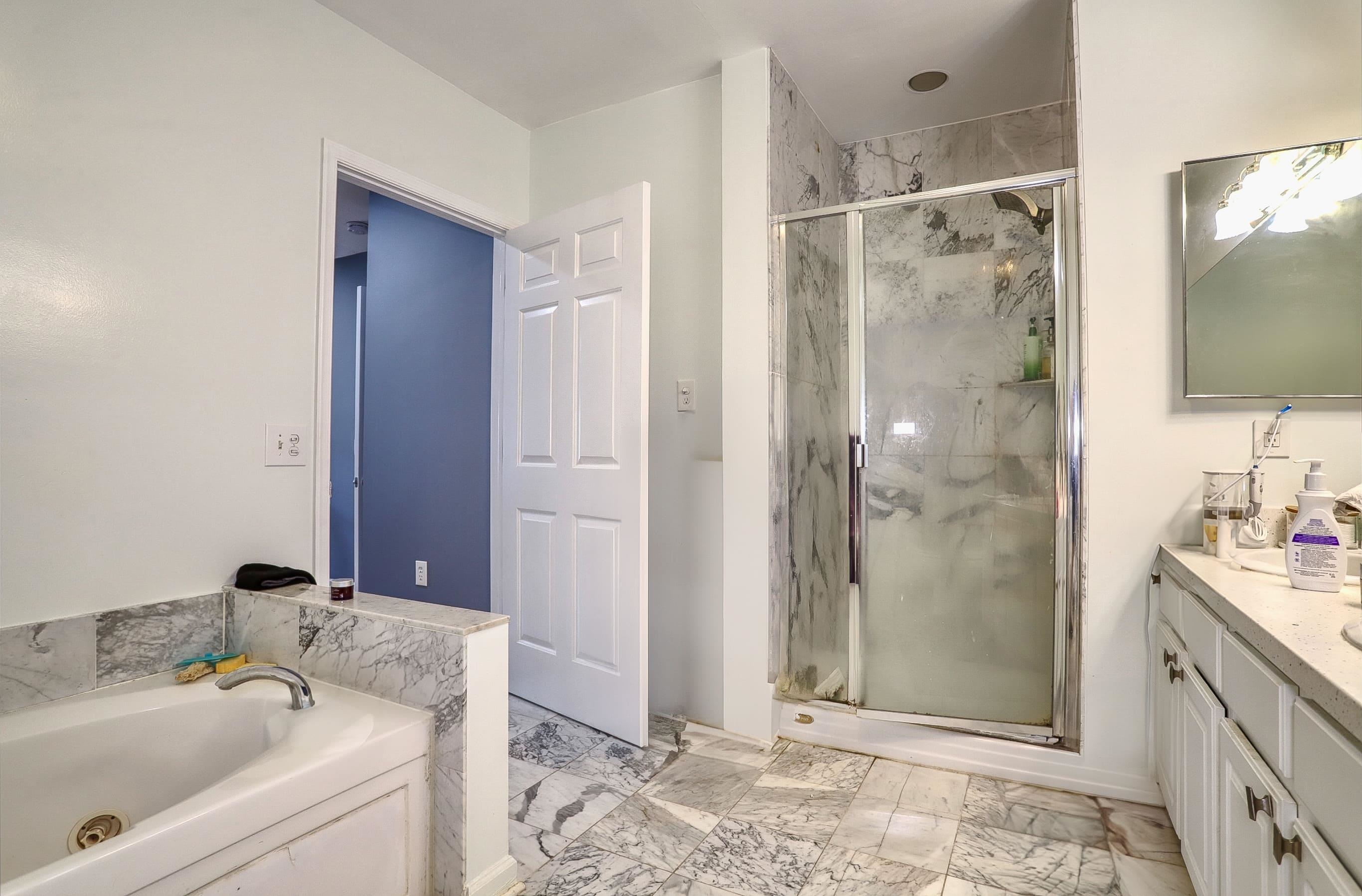 340 The Promenade, Unit 340 Edgewater, NJ 07020 - Photo 13 of 20 a bathroom with a sink and a mirror