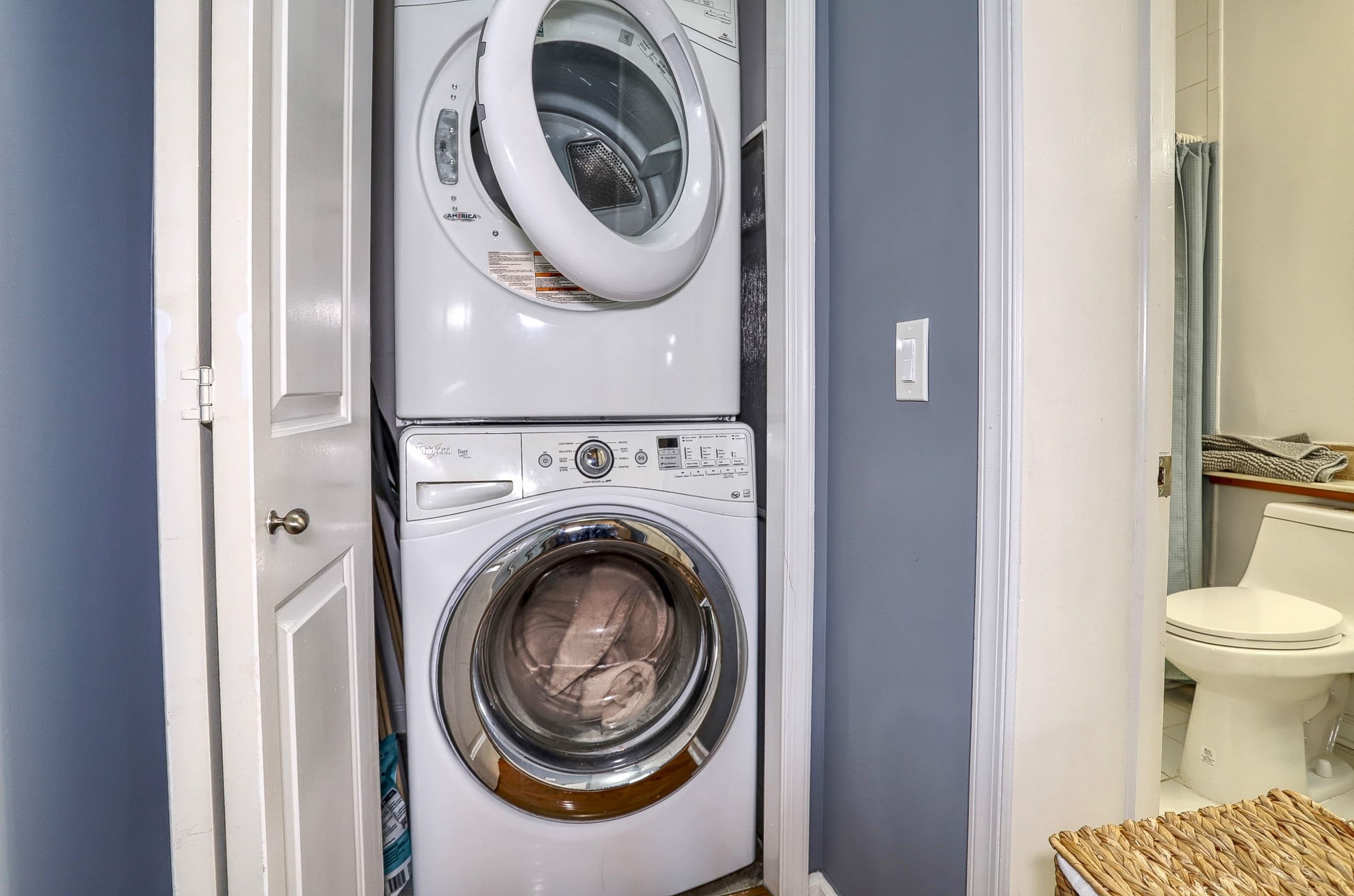 340 The Promenade, Unit 340 Edgewater, NJ 07020 - Photo 17 of 20 a view of a hallway with washer and dryer