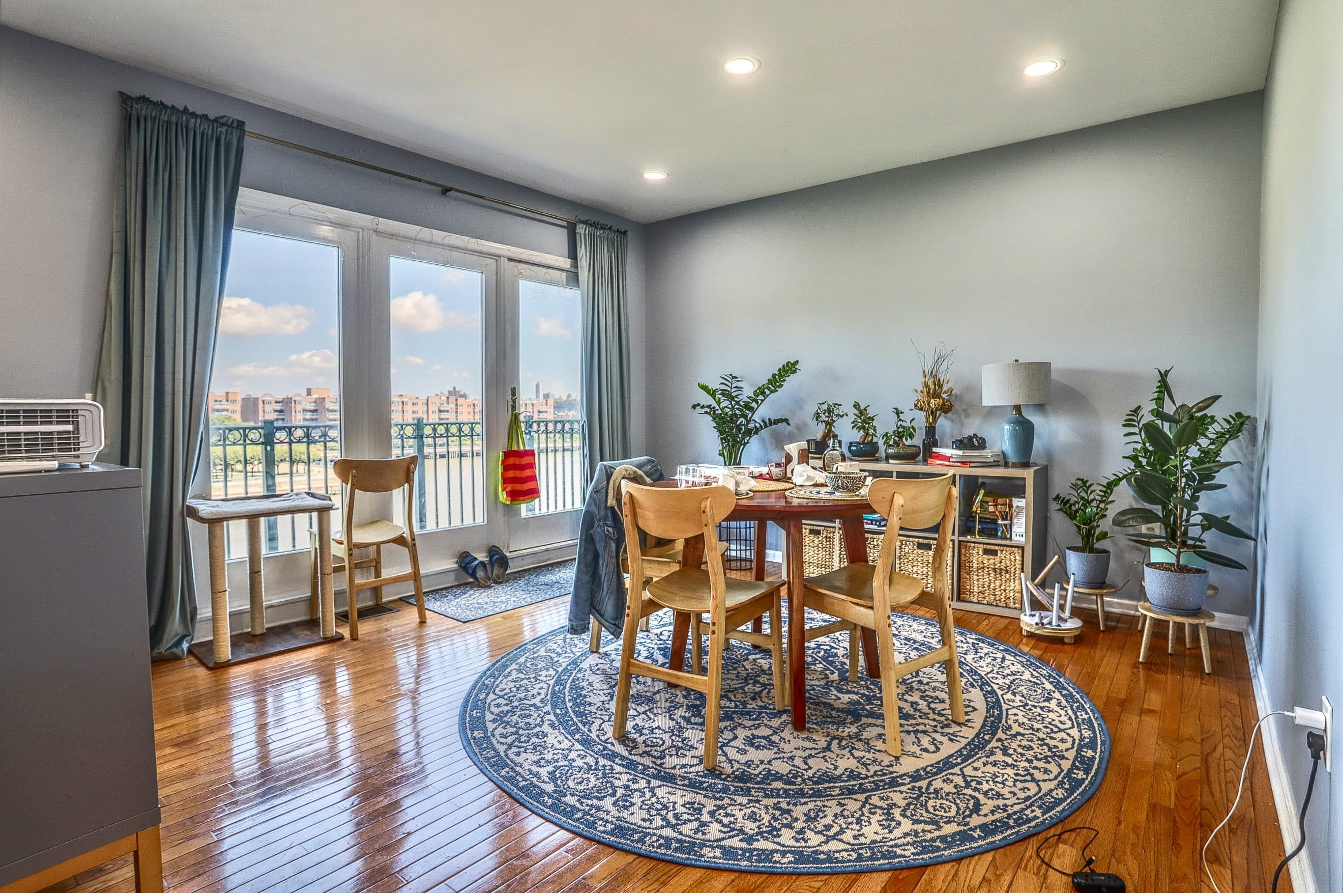 340 The Promenade, Unit 340 Edgewater, NJ 07020 - Photo 2 of 20 a view of a dining room with furniture window and wooden floor