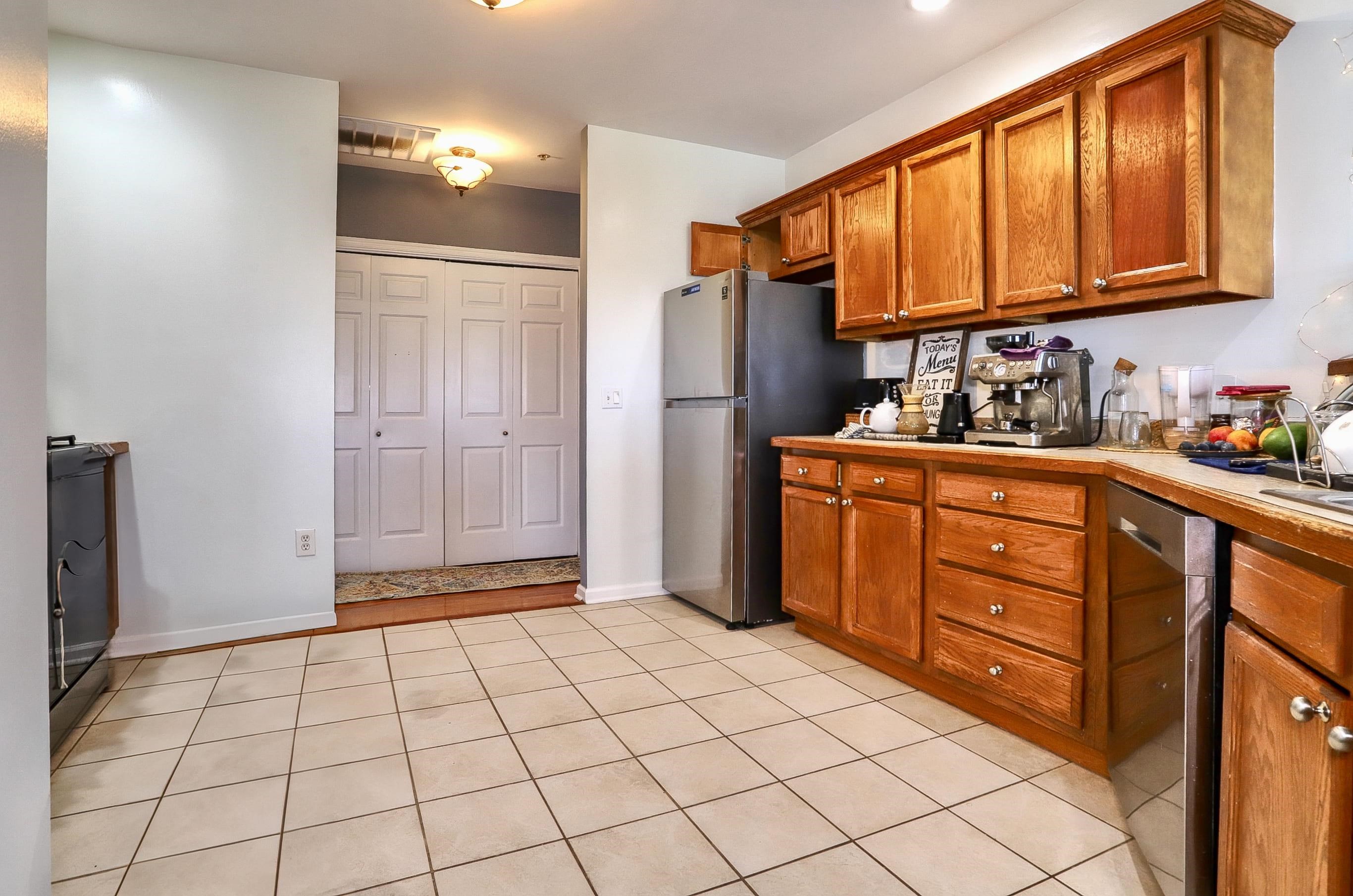 340 The Promenade, Unit 340 Edgewater, NJ 07020 - Photo 3 of 20 a kitchen with stainless steel appliances granite countertop a refrigerator and a sink