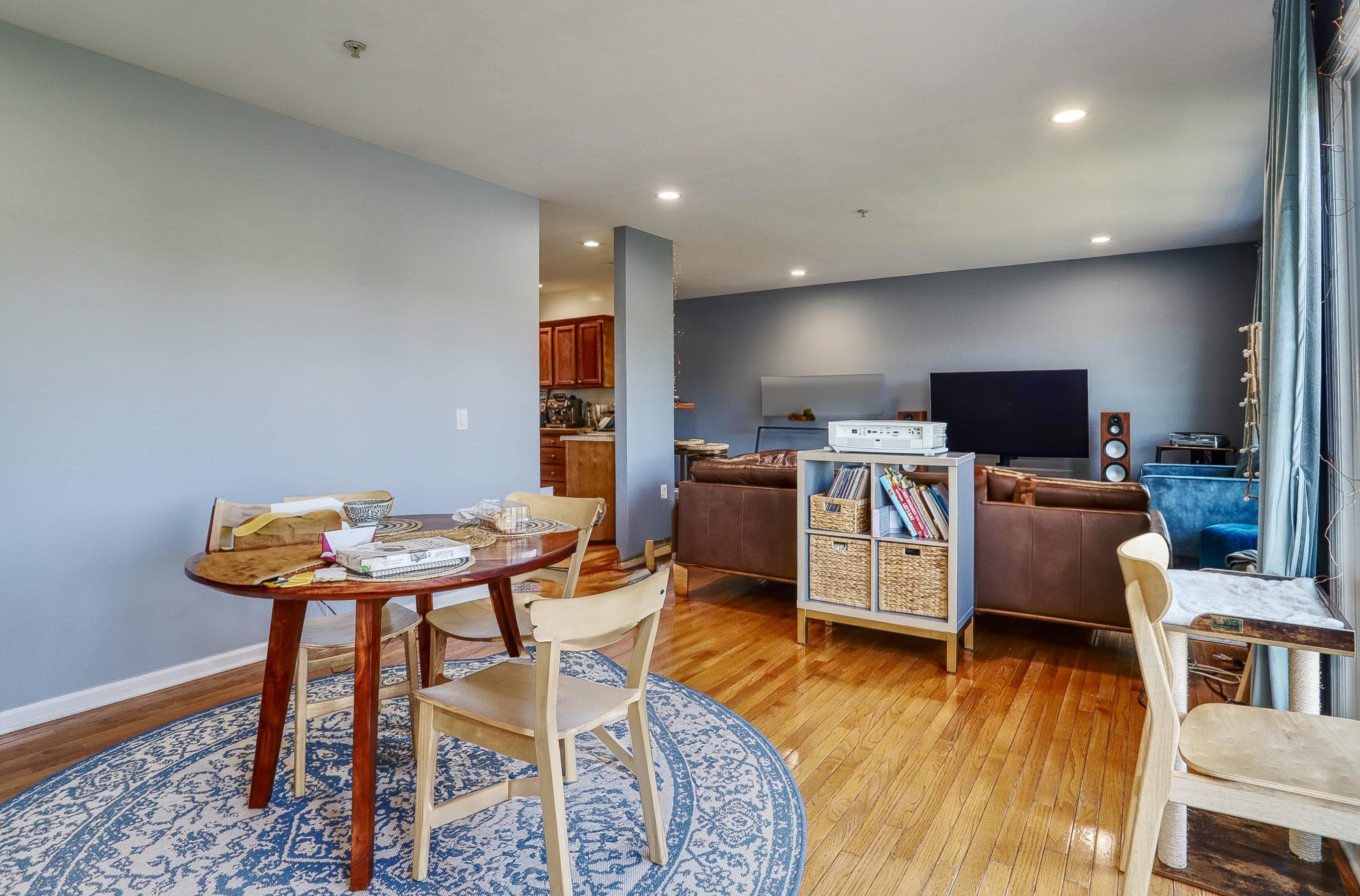 340 The Promenade, Unit 340 Edgewater, NJ 07020 - Photo 7 of 20 a view of a livingroom with furniture and a flat screen tv