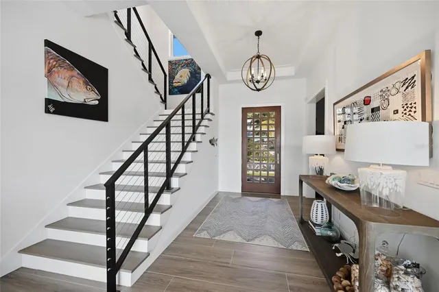 a kitchen with a table chairs sink and cabinets