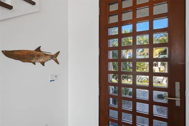 a large kitchen with sink a counter top space stainless steel appliances and cabinets