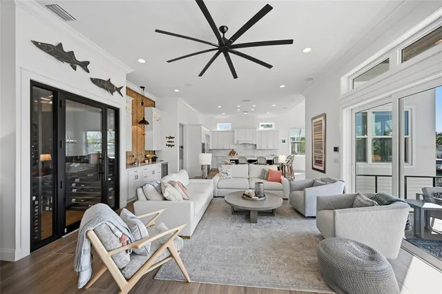 a dining room with furniture a chandelier and window