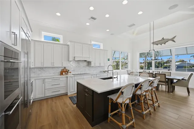 a view of a hallway with wooden floor and entryway