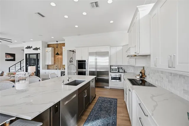a living room with furniture a rug and a window