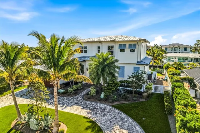 a view of a city with lawn chairs under an umbrella