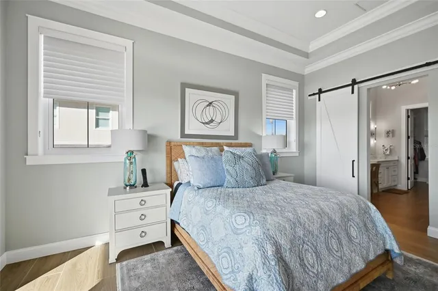 a bedroom with furniture and a window