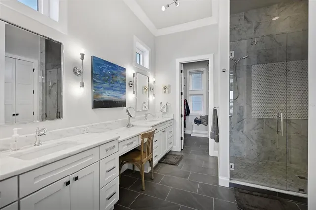 a bath tub sitting next to a bathroom sink