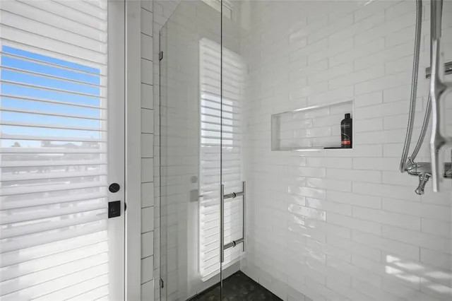 a view of swimming pool with outdoor seating and city view