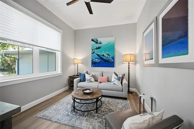 a view of a swimming pool with a patio and couches chairs