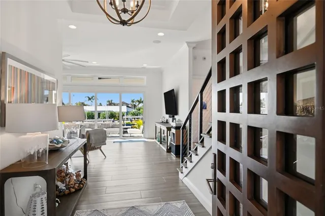 a kitchen with stainless steel appliances kitchen island granite countertop a stove a sink and a refrigerator