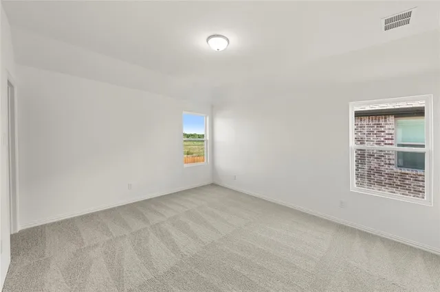 a bathroom with a sink double vanity and a mirror
