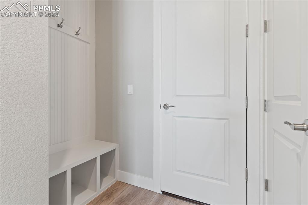2155 Coyote Mint Drive Monument, CO 80132 - Photo 11 of 45 a room with wooden floor