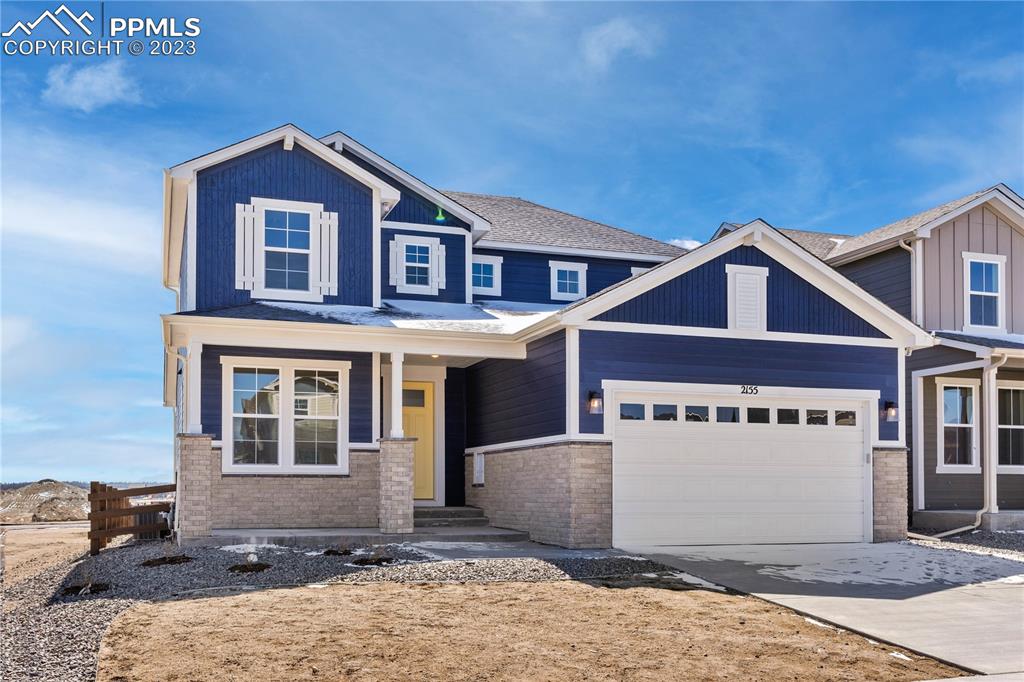 2155 Coyote Mint Drive Monument, CO 80132 - Photo 2 of 45 a front view of a house with a yard