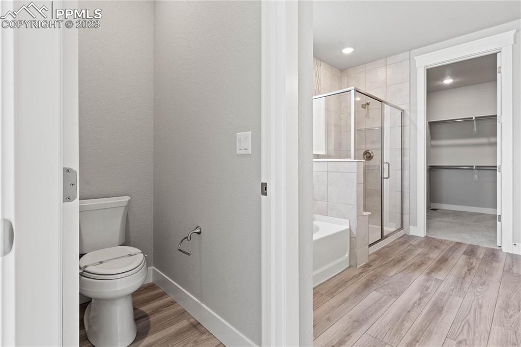 2155 Coyote Mint Drive Monument, CO 80132 - Photo 23 of 45 a bathroom with a toilet and a shower