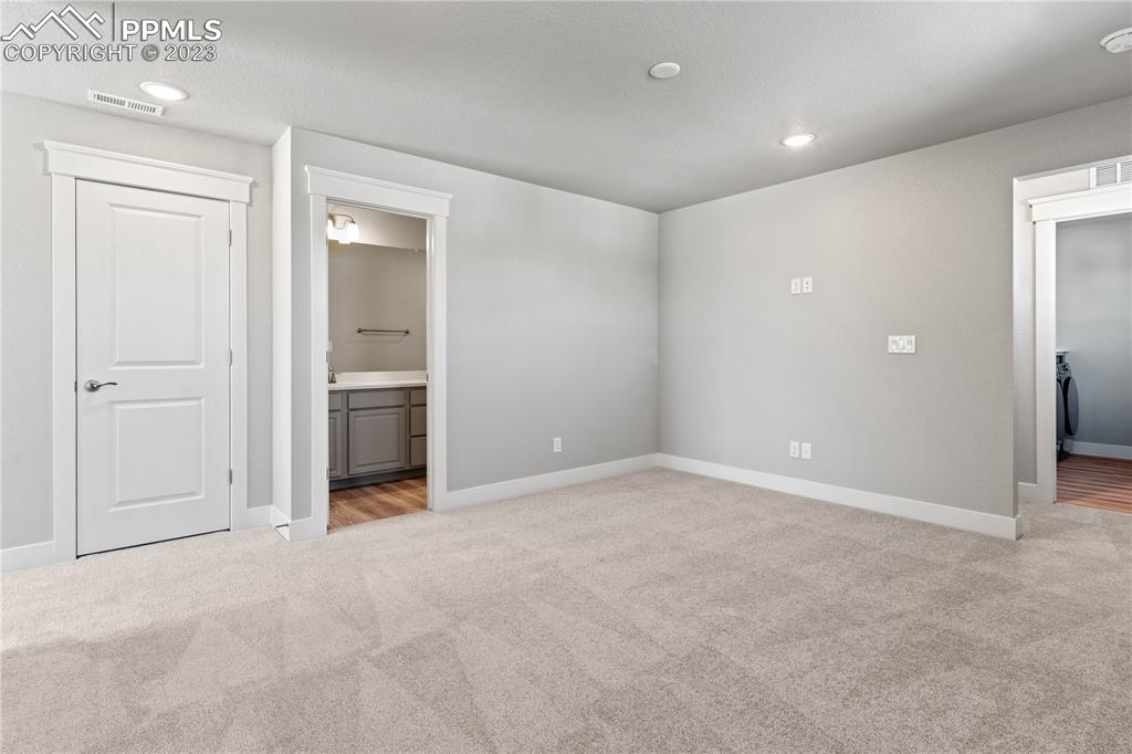 2155 Coyote Mint Drive Monument, CO 80132 - Photo 29 of 45 an empty room with closet and a bathroom