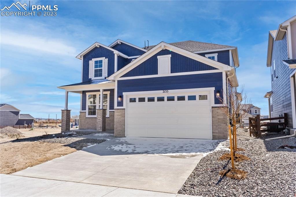 2155 Coyote Mint Drive Monument, CO 80132 - Photo 3 of 45 a front view of a house with a yard