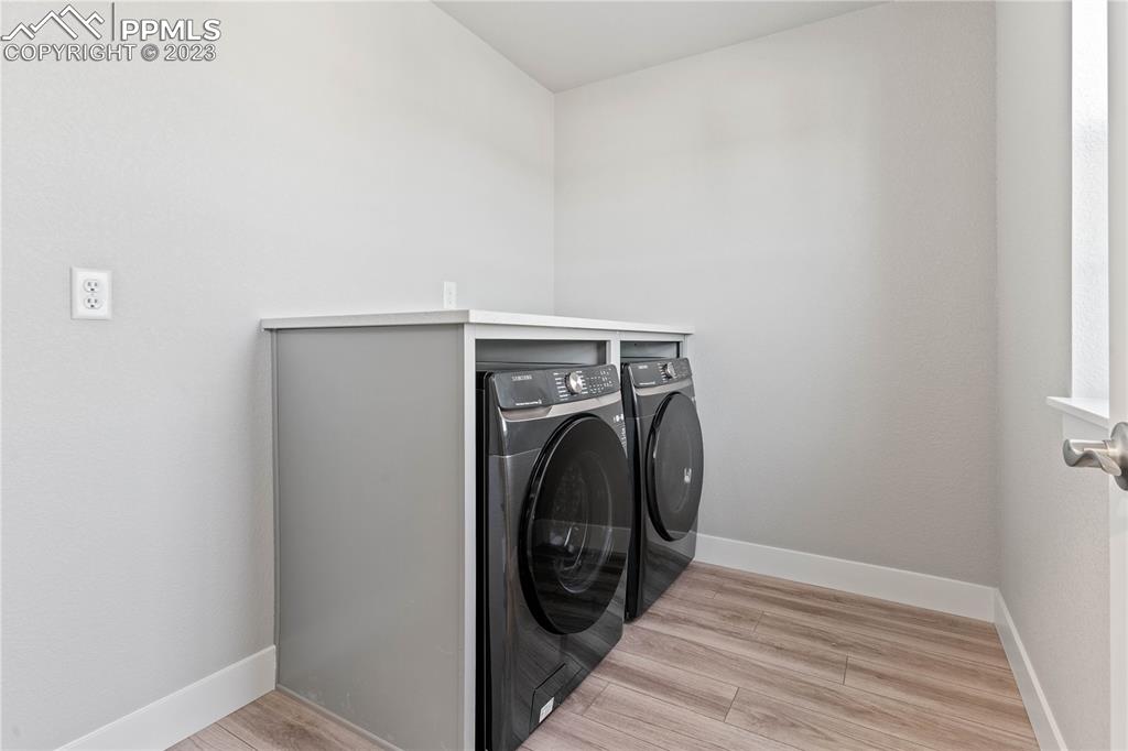 2155 Coyote Mint Drive Monument, CO 80132 - Photo 31 of 45 a utility room with dryer and washer