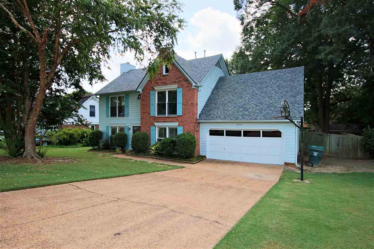 8541 Bazemore Road Memphis, TN 38018 - Photo 2 of 24 a front view of a house with a yard and trees