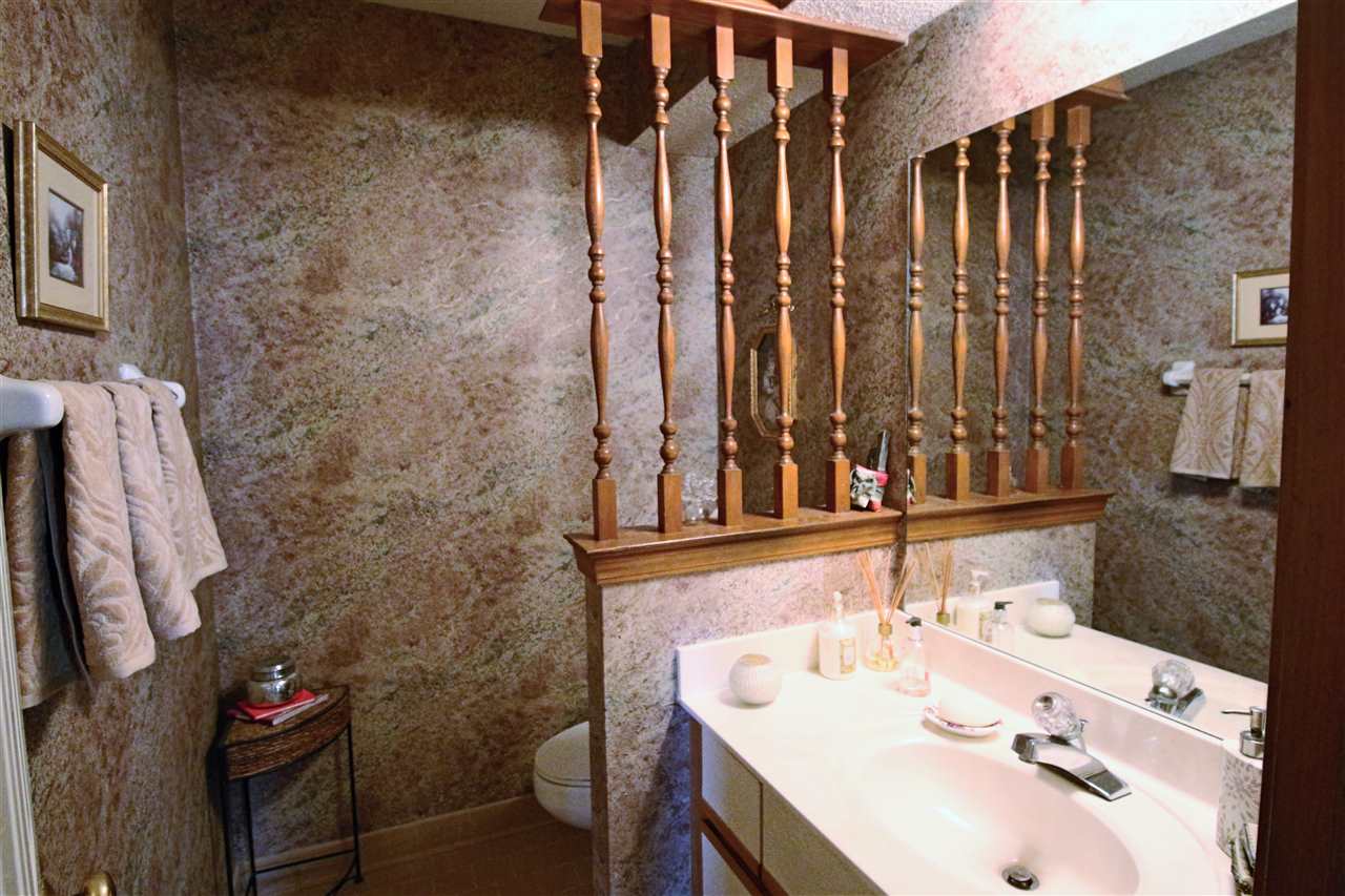 8541 Bazemore Road Memphis, TN 38018 - Photo 6 of 24 a bathroom with a sink vanity and a mirror