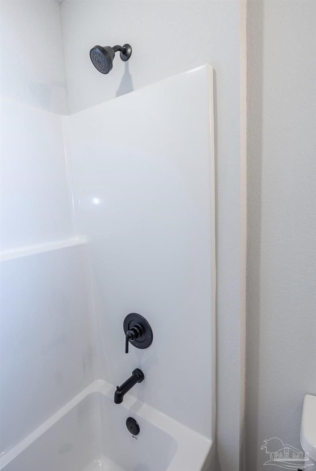 7657 Small Pnes Street Milton, FL 32583 - Photo 23 of 26 a bathroom with a shower and a toilet