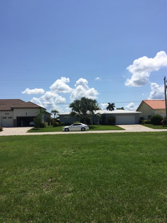 85 Colony Point Drive Punta Gorda, FL 33950 - Photo 6 of 9 a view of a green field
