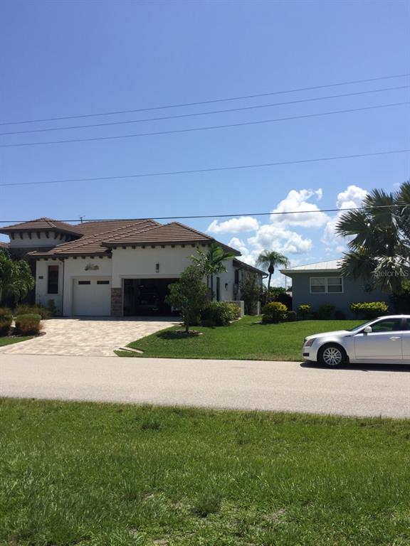 85 Colony Point Drive Punta Gorda, FL 33950 - Photo 9 of 9 a view of a house with a yard