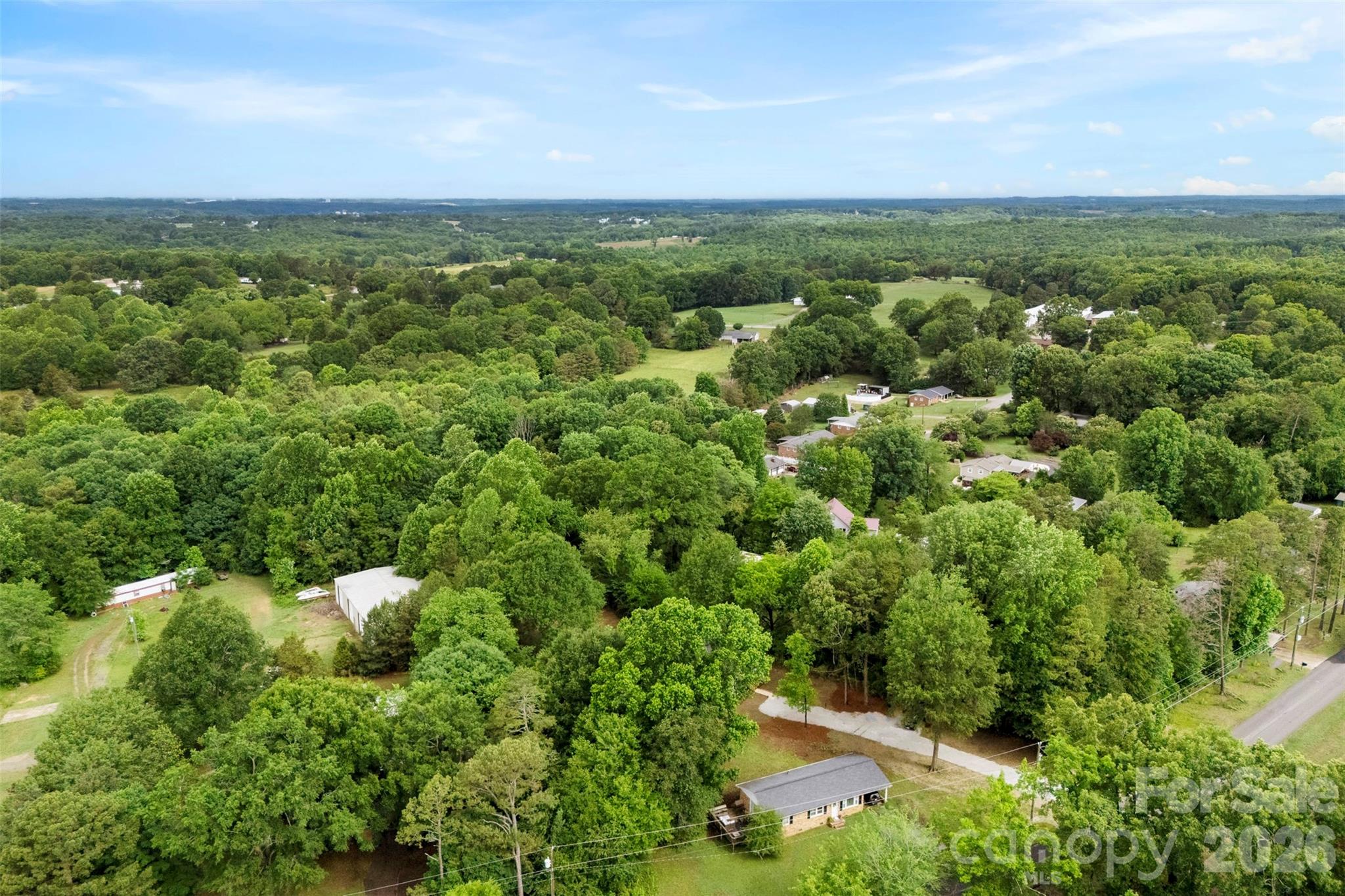 321 Bell Road Kings Mountain, NC 28086 - Photo 31 of 32 a view of a city with lush green forest
