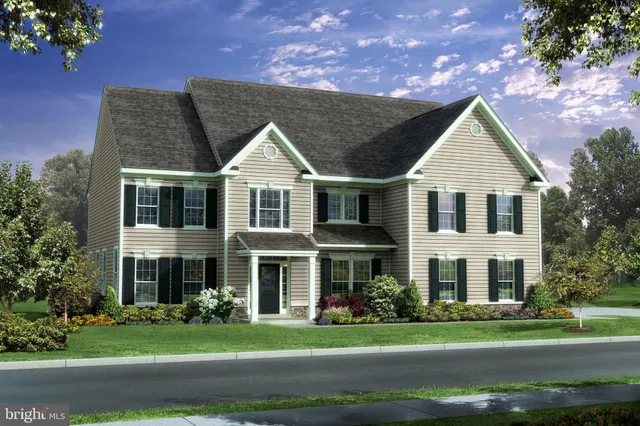 a view of a white house with a yard and plants
