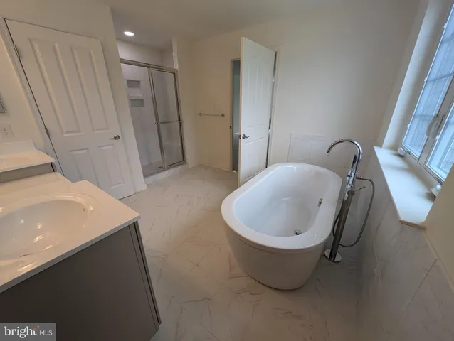 a bathroom with a sink and mirror
