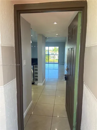 a view of an entryway of a hallway