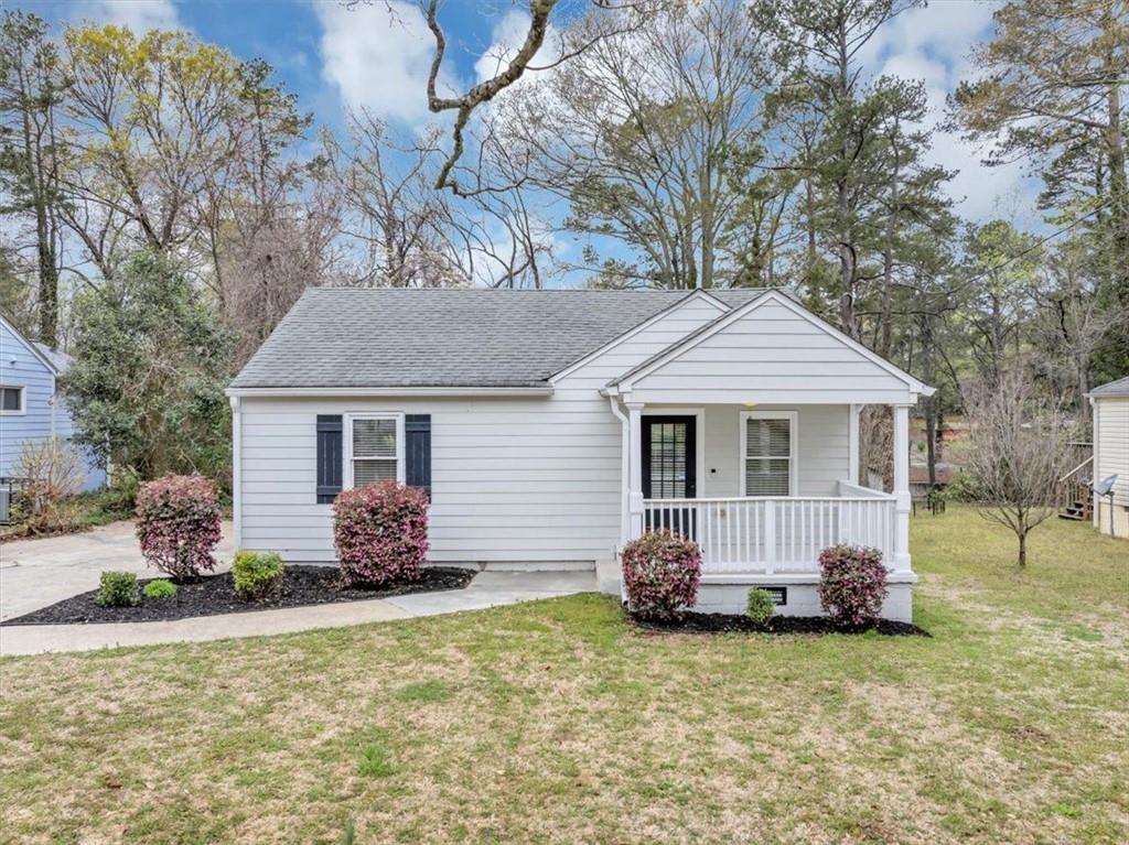 1991 McAfee Place Decatur, GA 30032 - Photo 1 of 1 a front view of a house with garden