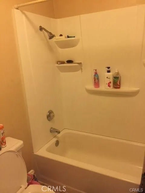 801 South Lyon Street, Unit A111 Santa Ana, CA 92701 - Photo 7 of 14 a bathroom with a tub and a toilet