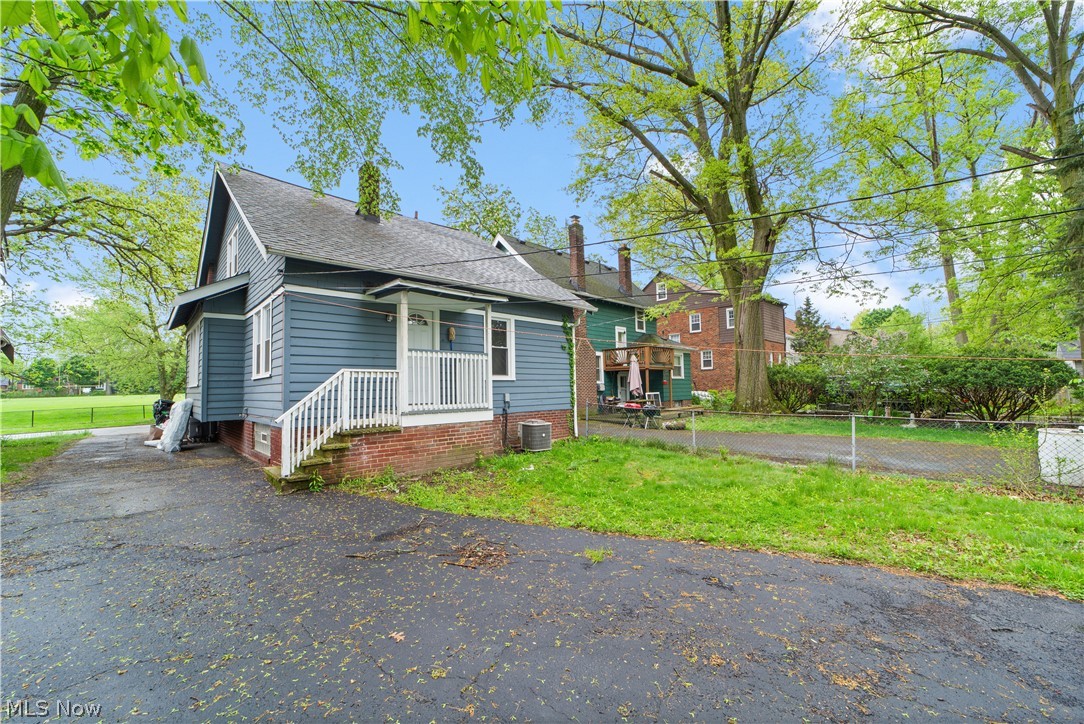 1062 Yellowstone Road Cleveland Heights, OH 44121 - Photo 28 of 29 View of front facade featuring covered porch and central AC unit