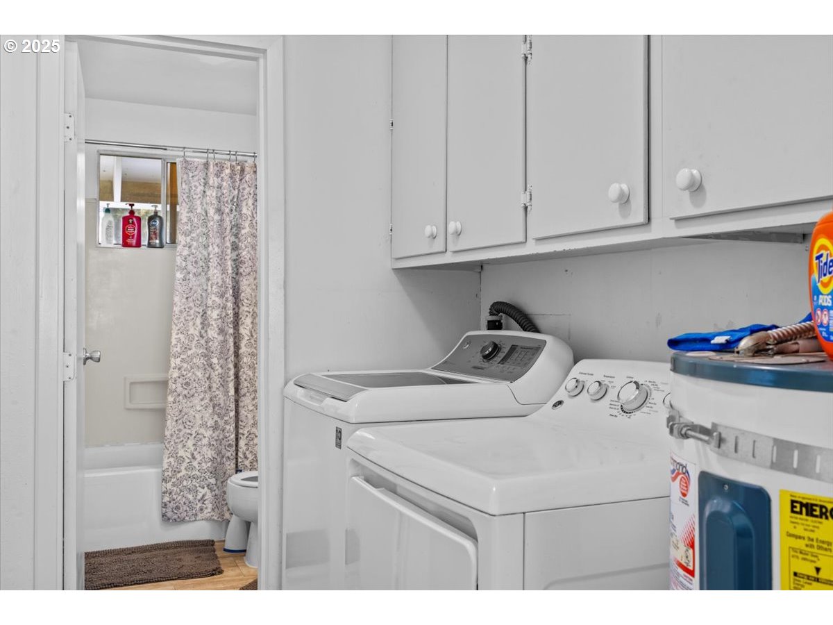 800 Byron Creek Road Winston, OR 97496 - Photo 27 of 35 a utility room with dryer and washer