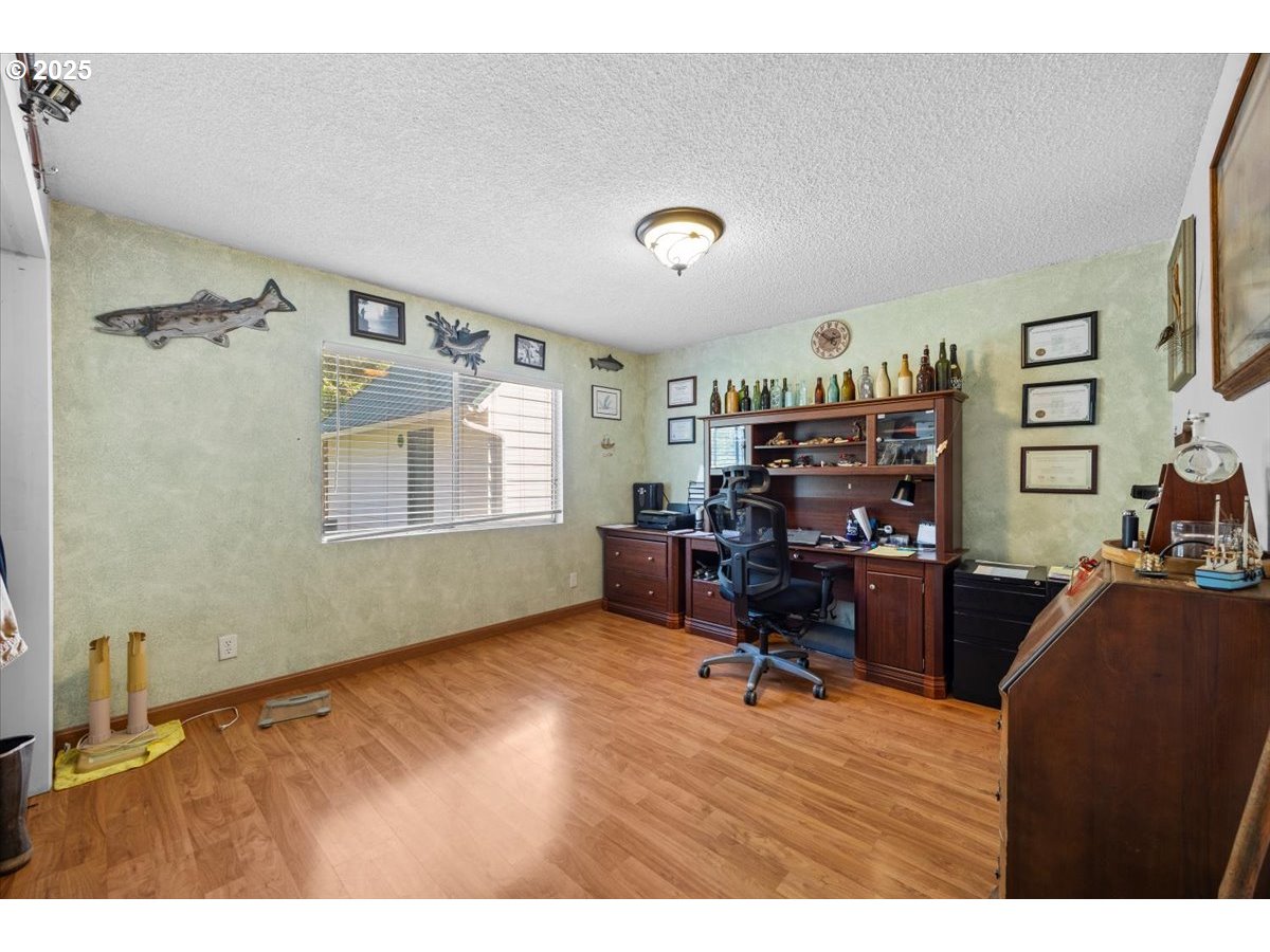 800 Byron Creek Road Winston, OR 97496 - Photo 28 of 35 a workspace with furniture hardwood and a window