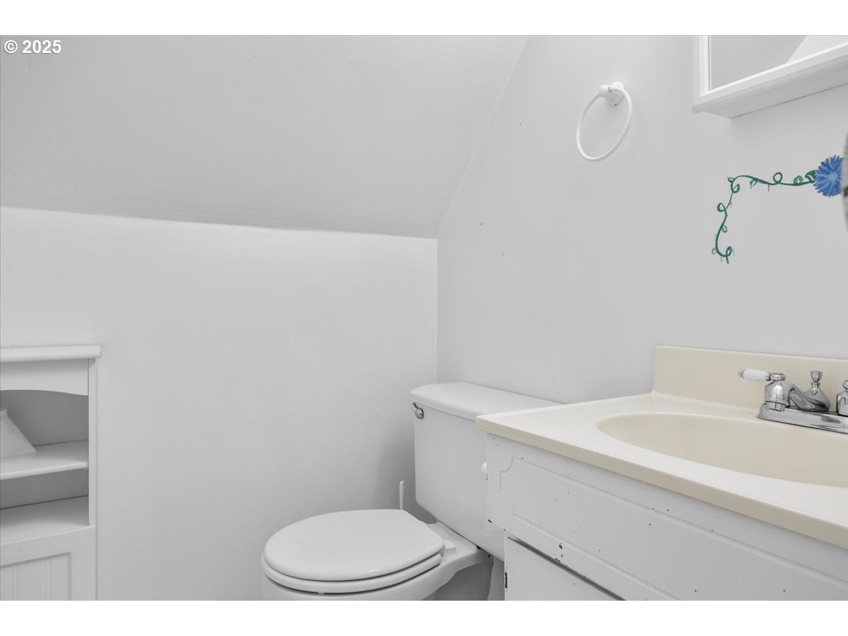 800 Byron Creek Road Winston, OR 97496 - Photo 35 of 35 a bathroom with a toilet a sink and mirror