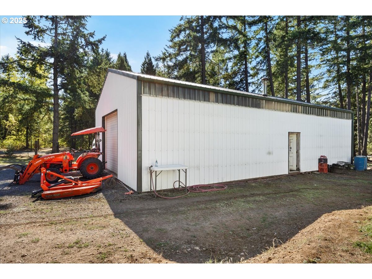 800 Byron Creek Road Winston, OR 97496 - Photo 8 of 35 a backyard of a house with cars parked