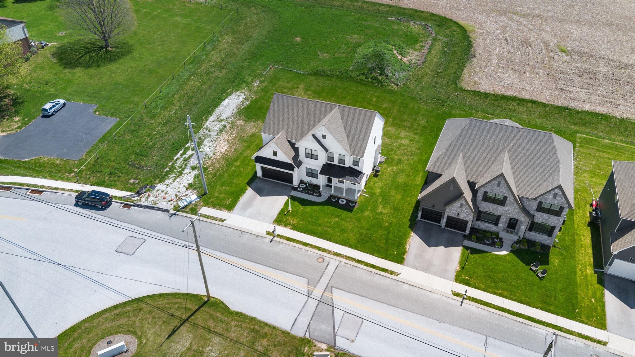 79 Beck Road York, PA 17403 - Photo 36 of 38 an aerial view of a house with a garden and a car parked