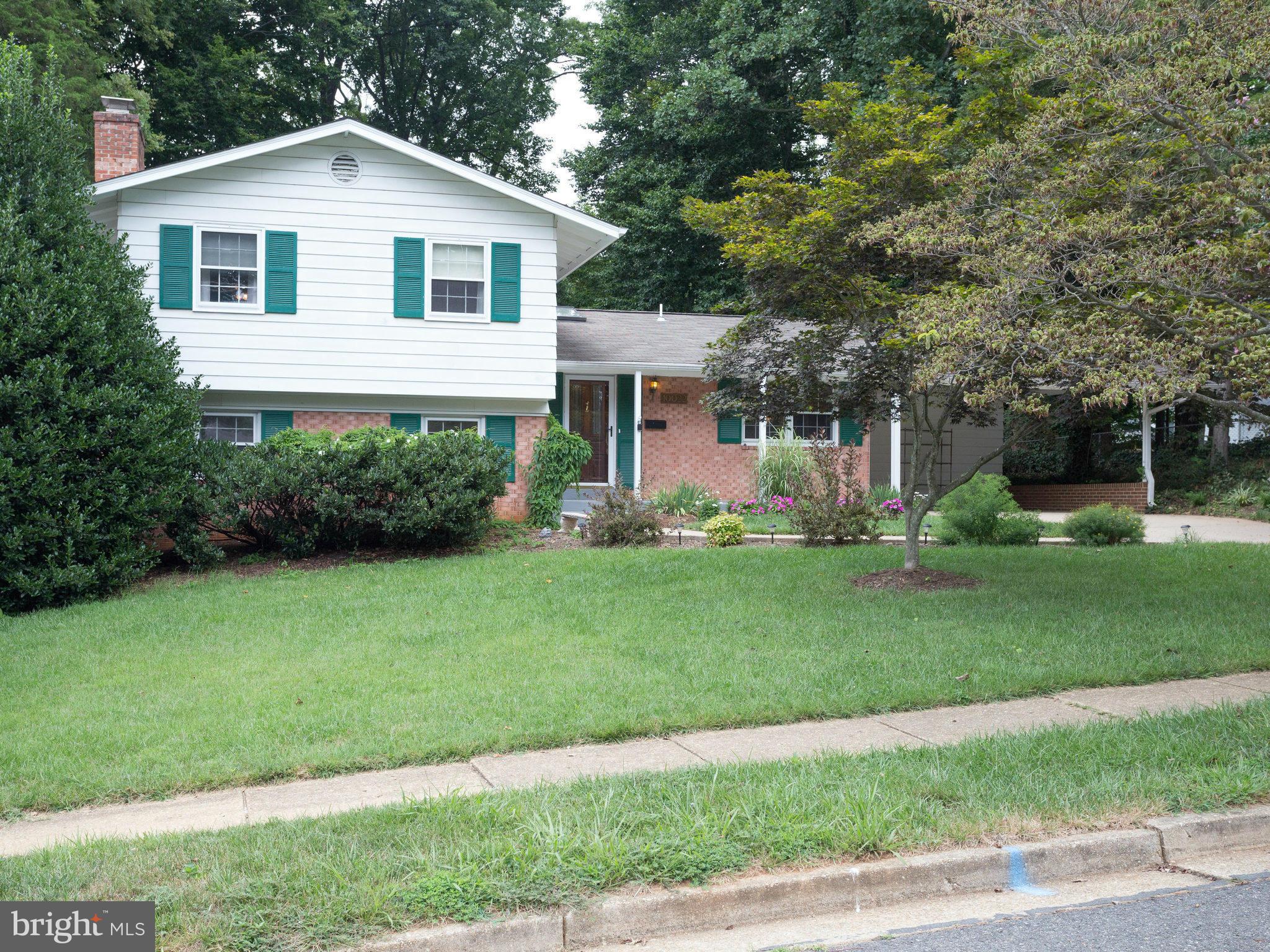 10022 Ranger Road Fairfax, VA 22030 - Photo 1 of 30 a front view of house with yard and green space