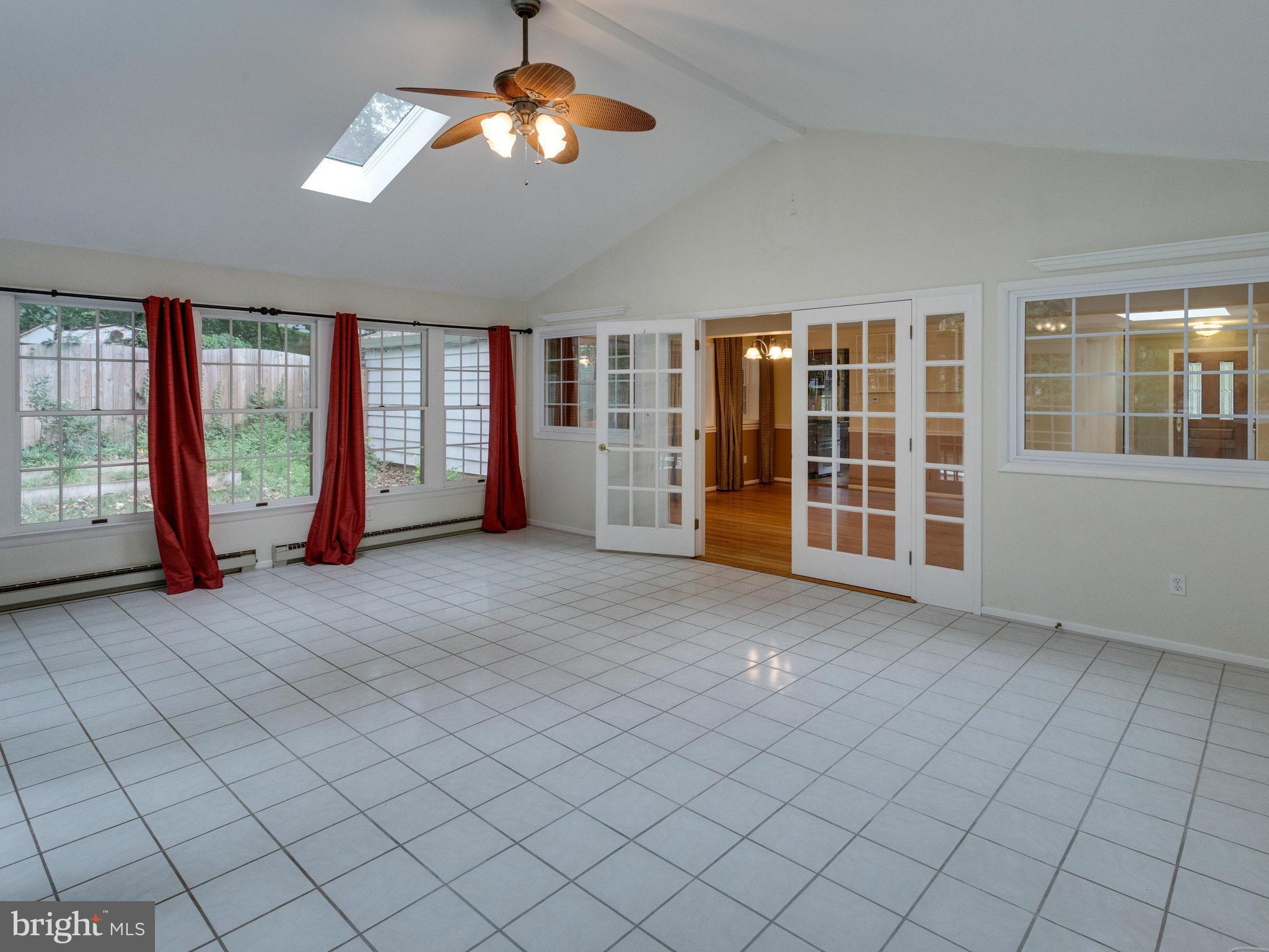 10022 Ranger Road Fairfax, VA 22030 - Photo 12 of 30 an empty room with chandelier fan and windows