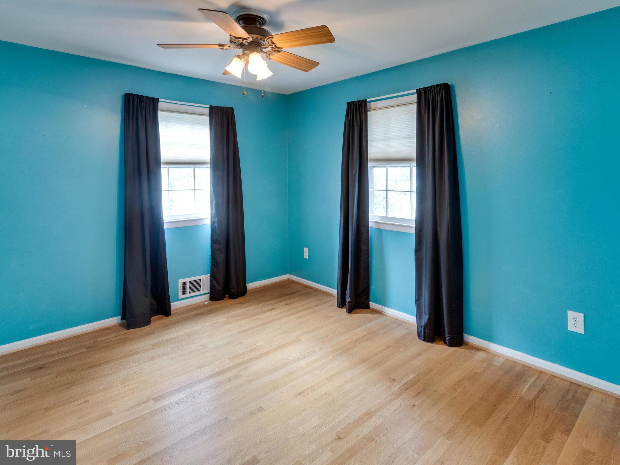10022 Ranger Road Fairfax, VA 22030 - Photo 16 of 30 a view of a livingroom with a chandelier fan and a window