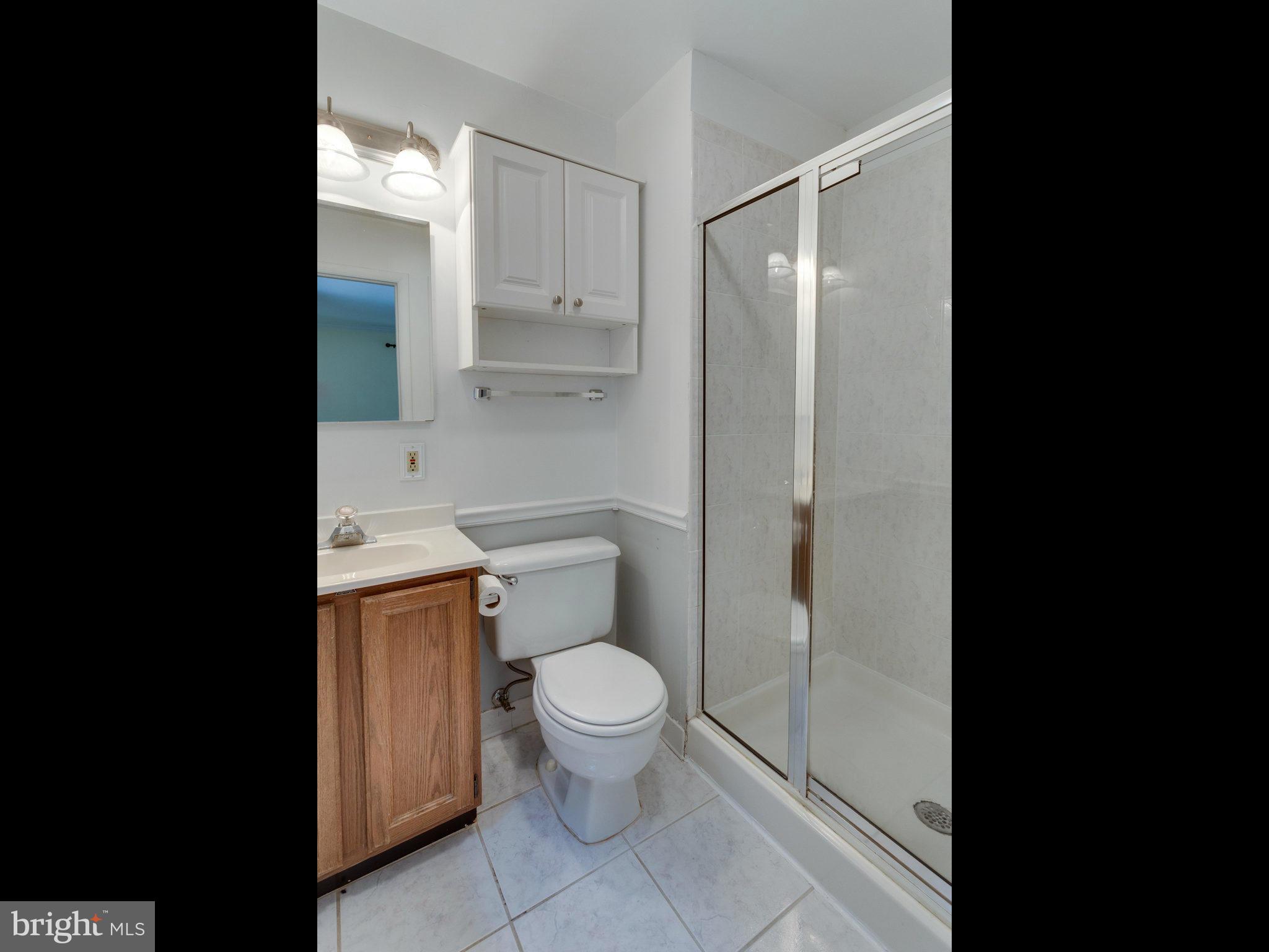 10022 Ranger Road Fairfax, VA 22030 - Photo 18 of 30 a bathroom with a toilet and a shower