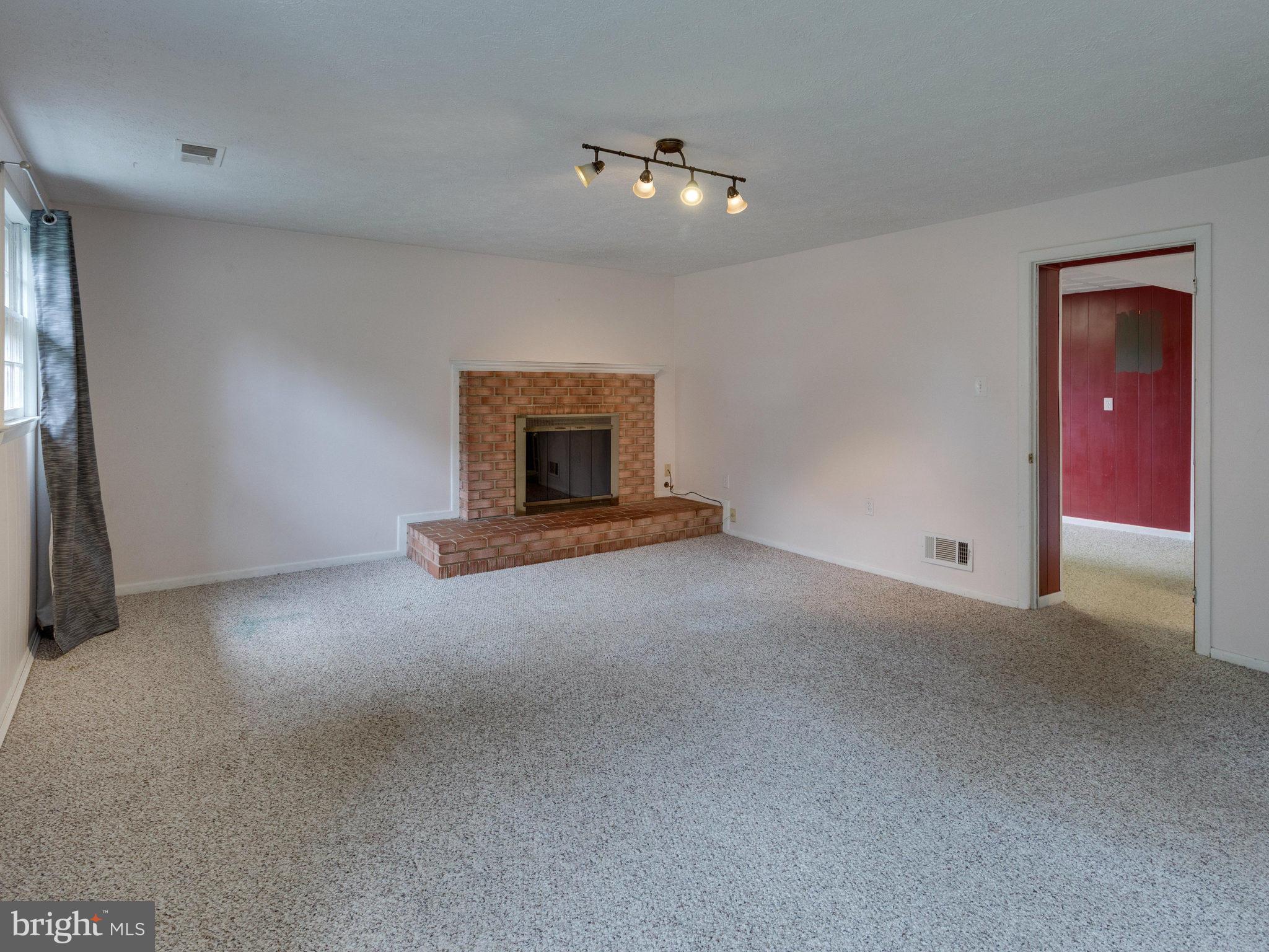 10022 Ranger Road Fairfax, VA 22030 - Photo 19 of 30 a view of an empty room with a fireplace