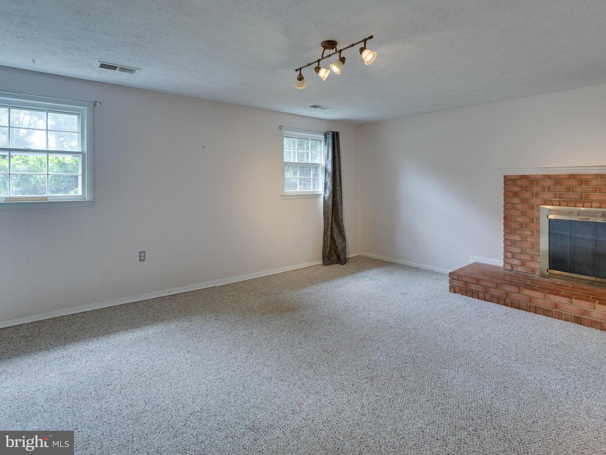 10022 Ranger Road Fairfax, VA 22030 - Photo 20 of 30 a view of empty room with a fireplace
