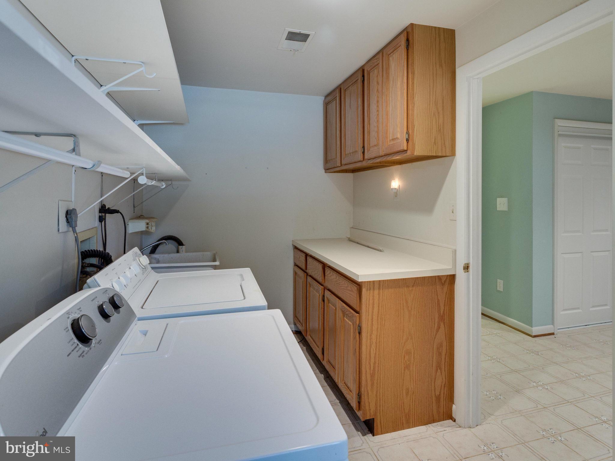 10022 Ranger Road Fairfax, VA 22030 - Photo 25 of 30 a hallway with washer and dryer