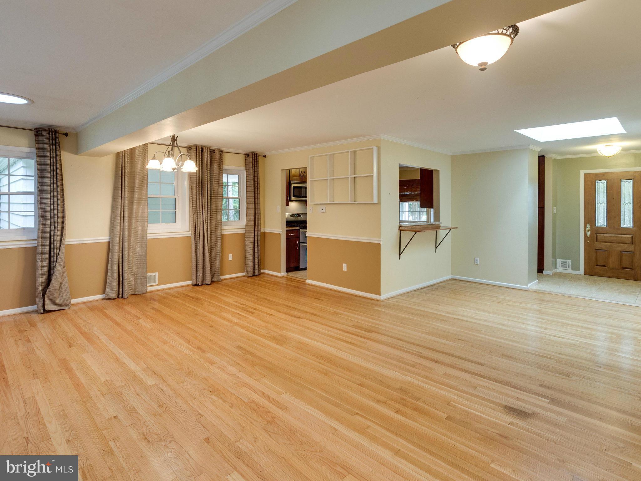 10022 Ranger Road Fairfax, VA 22030 - Photo 4 of 30 a view of an empty room with window and wooden floor