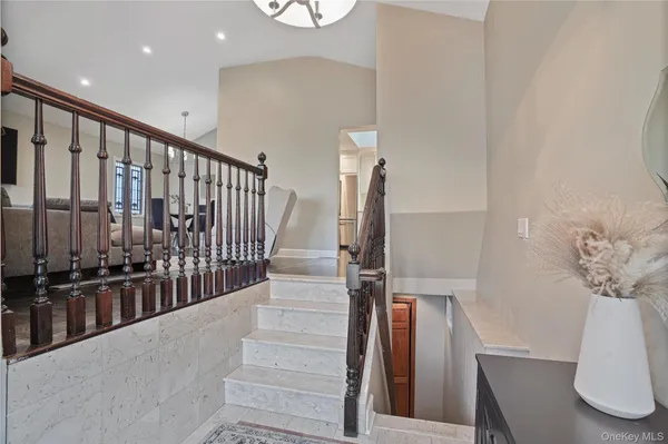 a view of staircase with white walls